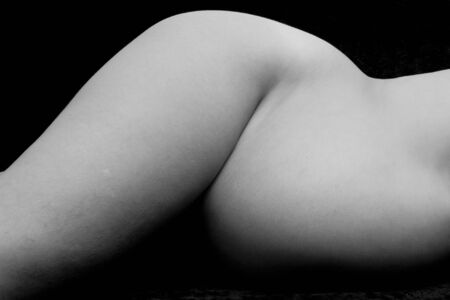 A black and white shot of a pregnant womanの写真素材