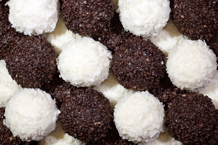background of dark chocolate and white chocolate sweetsの写真素材
