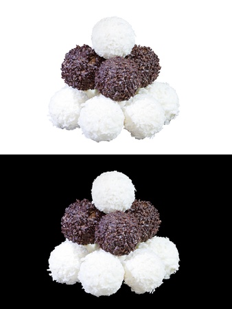 set of luxury chocolates in white, black and milk chocolate, isolated on white and black backgroundの写真素材