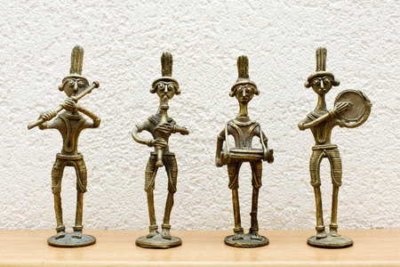 four African statues against the wallの写真素材