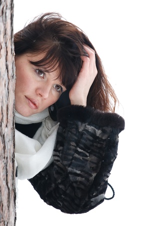 girl in winter clothes in pine isolated on white backgroundの写真素材