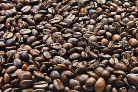 background of coffee grains at an angle of 45 degrees