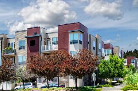 Street view of an apartment complex or condominiums on a nice partially cloudy day in state of Colorado.の写真素材