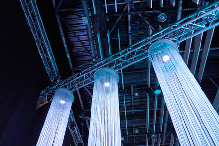 decorative stage with string curtains and blue lights