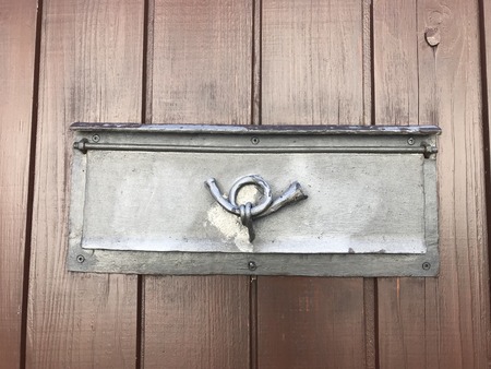 iron mail box flap in door with post horn