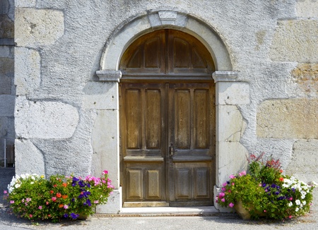 old wooden door of a Savoyard churchの写真素材