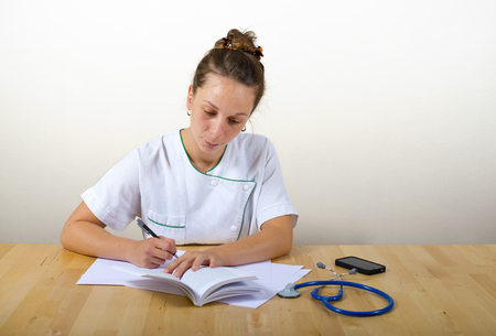 young female doctor writingの写真素材