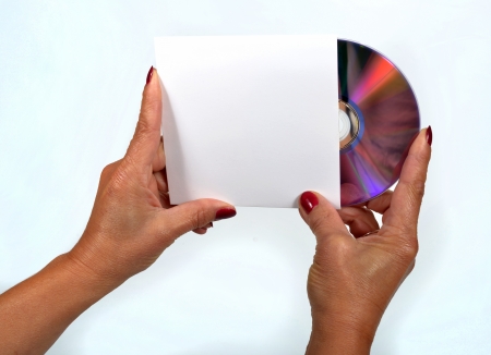 Young woman liking a CD-ROM and its dress handkerchiefの写真素材