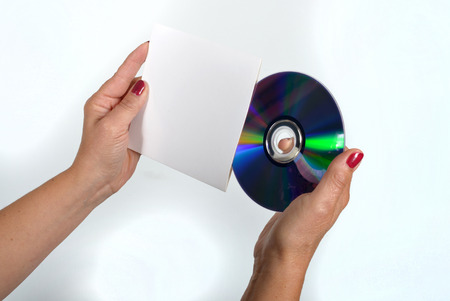 Young woman liking a CD-ROM and its dress handkerchiefの写真素材