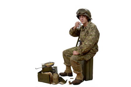 young American soldier in camouflage uniform drinkの写真素材