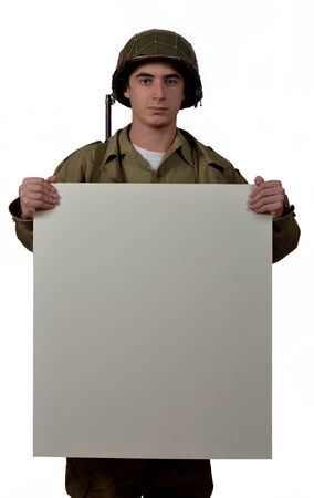 young American soldier with M1 helmet shows a signsの写真素材