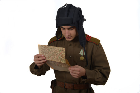 young Soviet tanker look at a map  he have a tanker helmetの写真素材