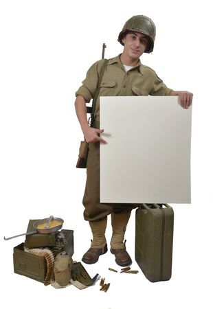 American soldier with M1 helmet shows a signsの写真素材