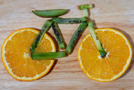 bike with fruits,orange and kiwi