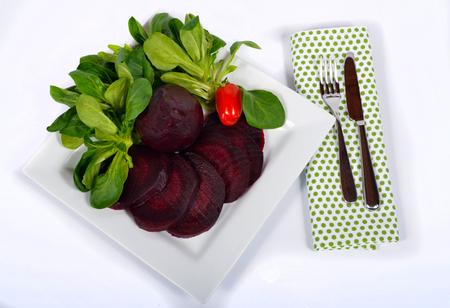 plate of beet salad isolated on a white backgroundの写真素材