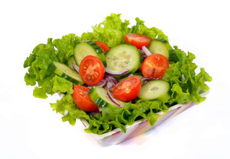 salad with vegetables and greens on the white backgroundの写真素材