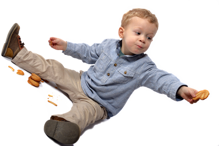 Baby dressed in a blue shirt with cookiesの写真素材