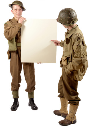 bristish and american soldier present a plate on the white backgroundの写真素材