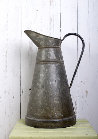 vintage pitcher on the white wallの写真素材