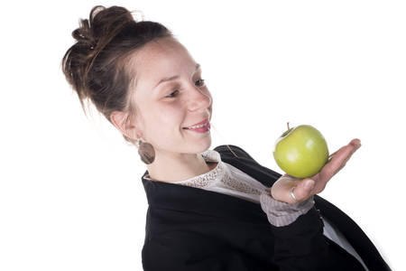  young woman holding an appleの写真素材