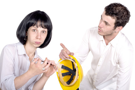 Secretary making fun of his colleagueon white backgroundの写真素材