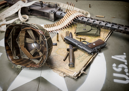 map of Normandy placed on the hood of military vehicle with weaponsの写真素材