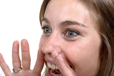  young woman screams on the white backgroundの写真素材