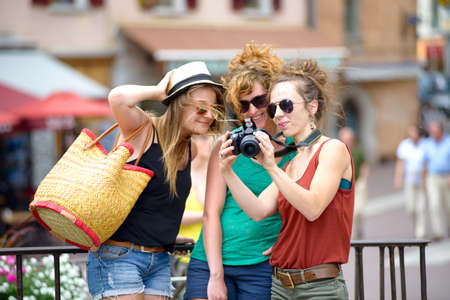 three young women make tourism の写真素材