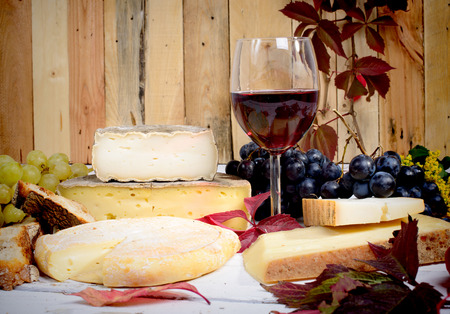 french cheese platter with wine and grapesの写真素材