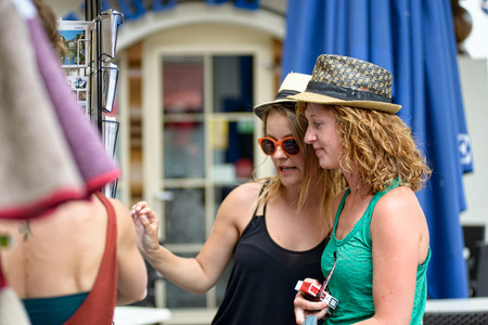 three young women go shoppingの写真素材