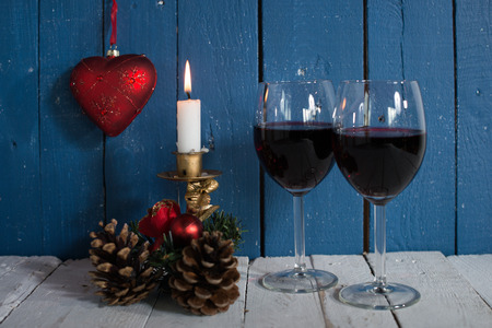 glasses of red wine with Christmas decorationの写真素材