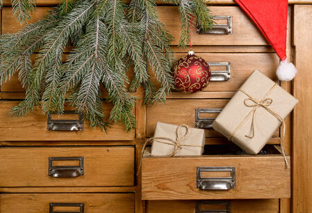 Christmas gifts in the drawer of a cabinetの写真素材