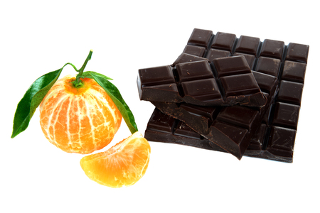 mandarine and chocolate tablet on white backgroundの写真素材