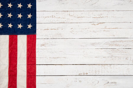 white wooden background with an American flagの写真素材