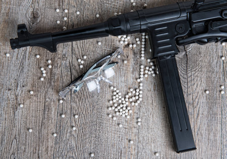 airsoft gun with glasses and lot of bullets