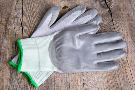 protective gloves for work on the wooden table