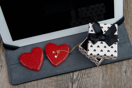 digital tablet with a rose and gift for valentine dayの写真素材