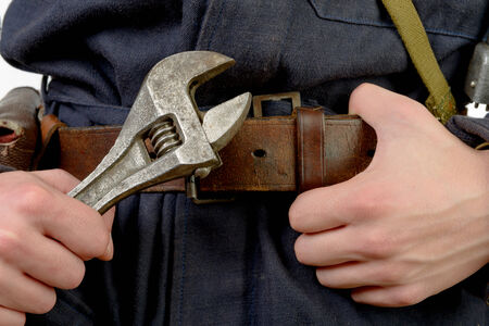 close-up adjustable wrench and hands of mechanicの写真素材