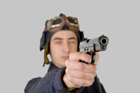 tank driver Soviet soldier fires with handgunの写真素材