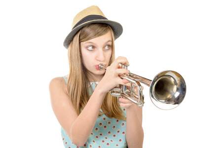 teenager with a hat plays the trumpetの写真素材