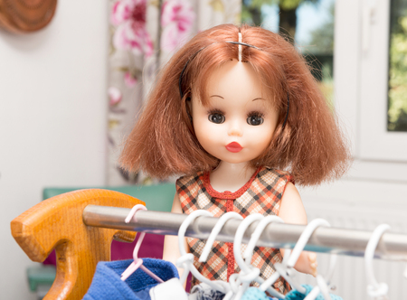 doll with red hair and several dressesの写真素材