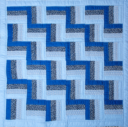 a patchwork background with different colored patterns