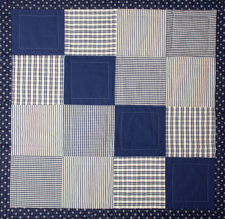 a patchwork background with different colored patternsの写真素材