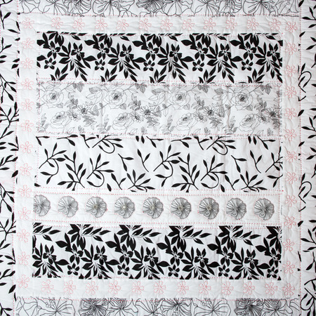 a patchwork background with different colored patterns