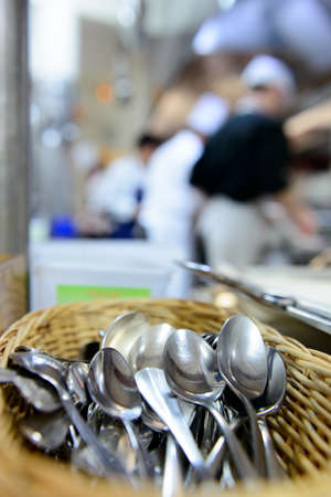 Small spoons in the kitchen of a french restaurantの写真素材