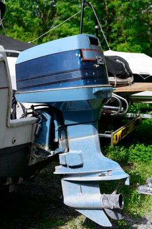 a blue outboard engine with a propellerの写真素材