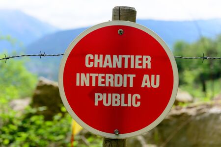 french red and white sign indicating a construction siteの写真素材