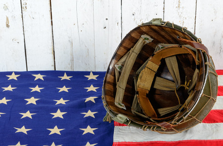 wwii military helmet on american flagの写真素材