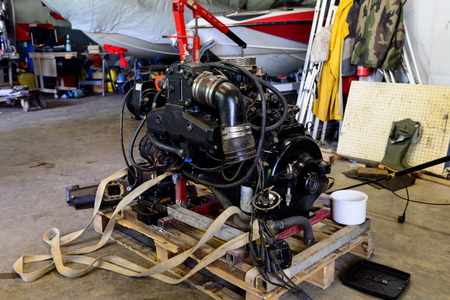 boat engine disassembled in a repair shopの写真素材