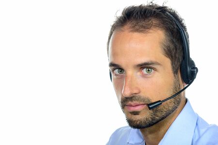 Handsome customer service operator wearing a headset on white background